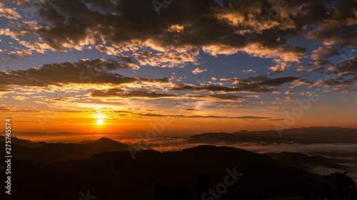 landscape silhouette mountain fog and the sunset with  background at morning time in Thailand
