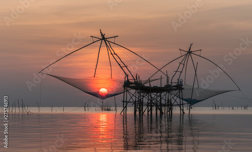 Giant fishing gear call Yor in Thai with beautiful sunrise scenery at Pakpra canal, Phatthalung.