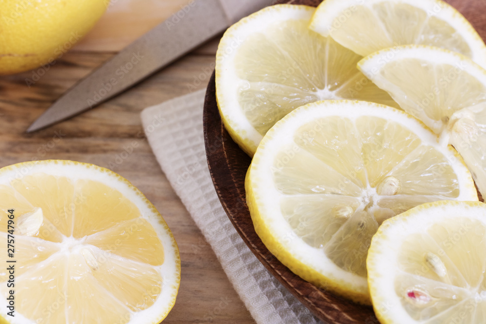 lemon is cut into slices, the process of cooking lemon dishes, juicy pieces of tropical fruits, dietary fruits, healthy foods, ingredients for cocktails lemon is cut into slices, the process of cooking lemon dishes, juicy pieces of tropical fruits, dietary fruits, healthy foods, ingredients for cocktails