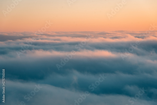 View of marine layer low clouds over Los Angeles at sunset, from Mount Wilson, in Angeles National Forest, California © jonbilous