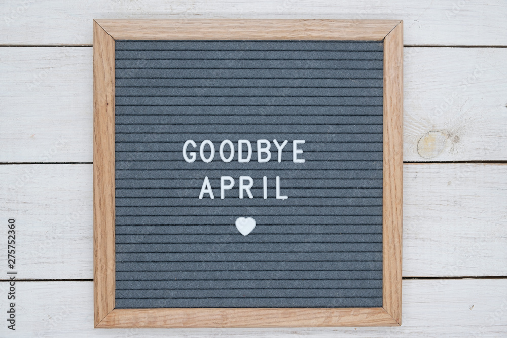 Φωτογραφία text in English goodbye April and a heart sign on a gray felt Board in a wooden