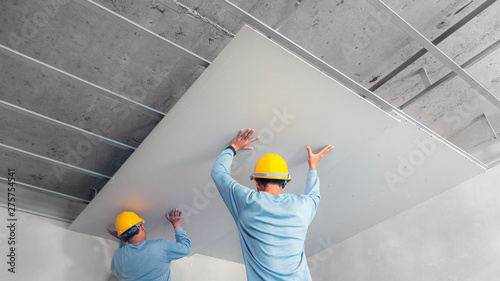 Ceiling installation with acoustic panels With professional technicians photo