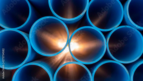 Obraz na plátně Group of blue water pipes That is stacked into a graphic format With light comin
