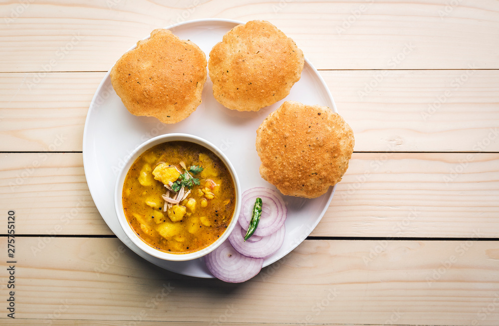 Puri and Potato Curry - famous breakfast of india Puri and Potato Curry - famous breakfast of india