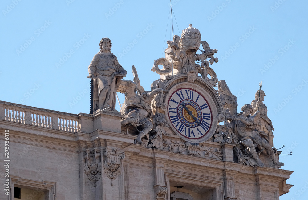 One of the giant clocks on the St. Peter's facade. Two clocks were added in 1786-1790 by Giuseppe Valadier. Papal Basilica of St. Peter in Vatican, Rome, Italy.
