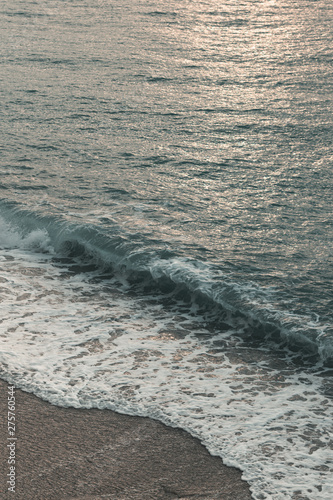 epic dawn and sea with waves and foam