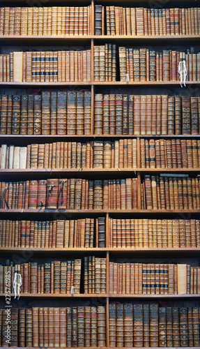 old books on wooden shelf