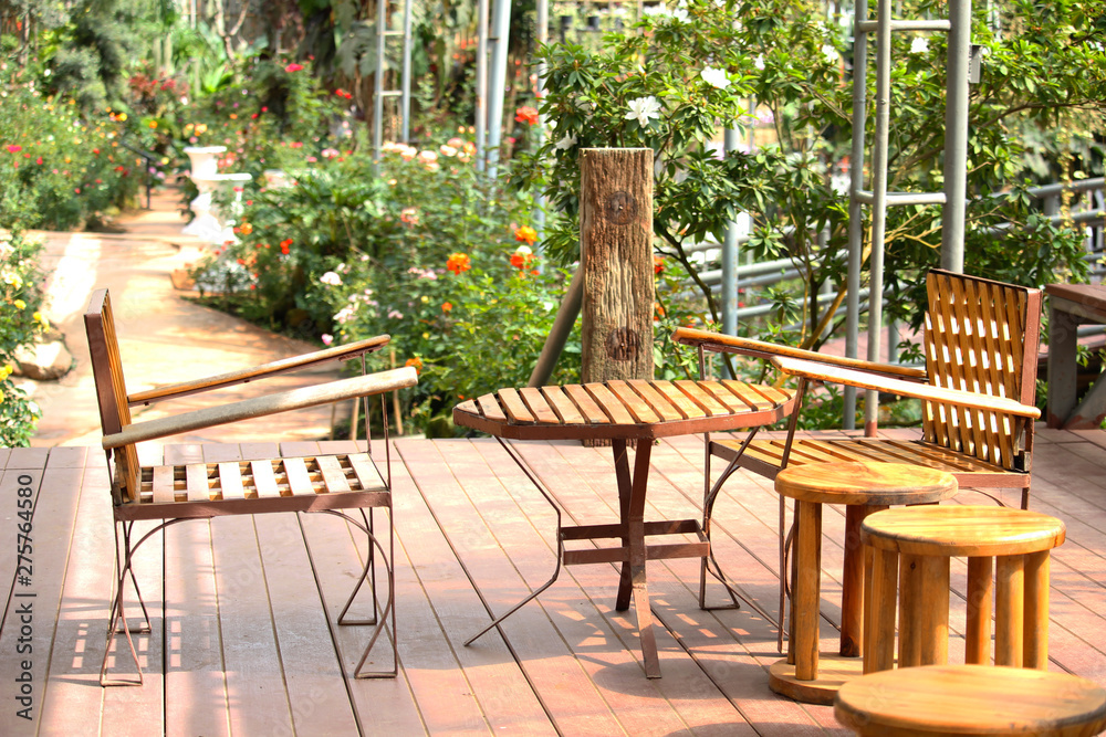 Chairs and tables made of wood For sitting in a beautiful garden