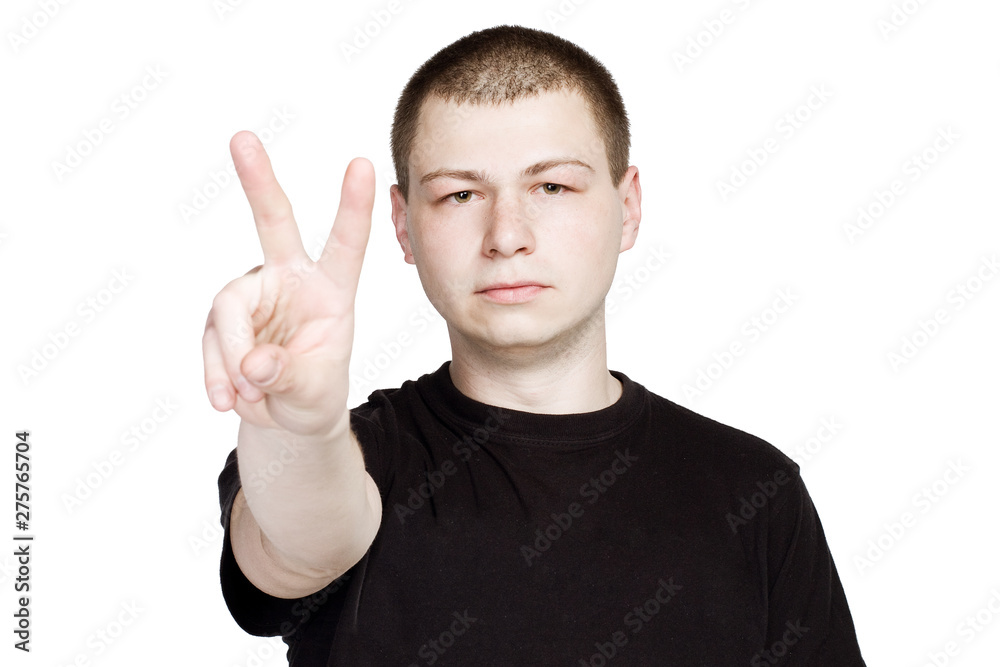 Man in black t-shurt Shows Number Two or Peace Sign Gesture. Man in black t-shurt Shows Number Two or Peace Sign Gesture.