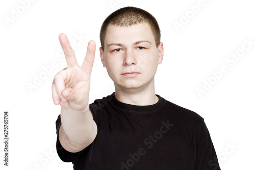 Man in black t-shurt Shows Number Two or Peace Sign Gesture.