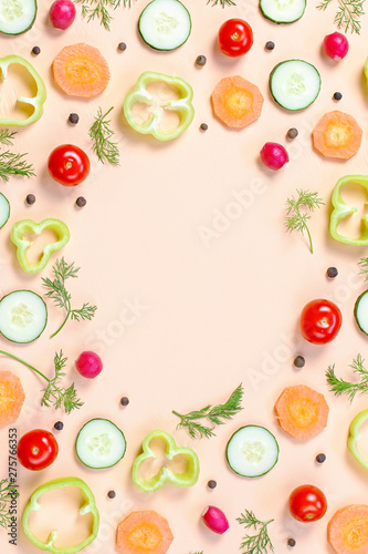 Salad ingredients layout. Food pattern with cherry tomatoes, carrot, cucumbers, radish, greens, pepper and spices