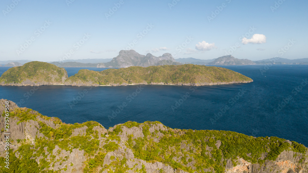 Seascape with islands. Blue sea and large islands. Big island with woodland. Philippines,