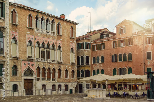 Outdoors in Venice. Old antique houses and cafes