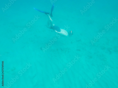 Man diving towards the sea bottom