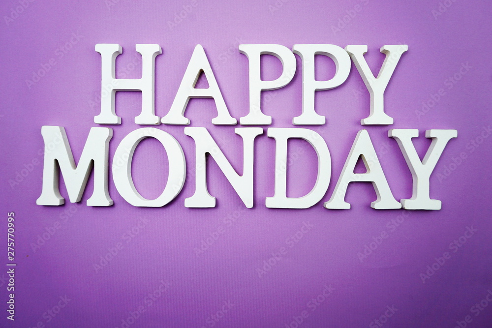 Happy Monday wooden letter alphabet on purple background