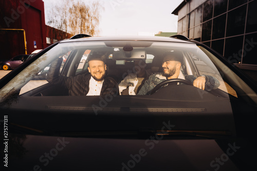 A bunch of friends having fun in the car. Summertime