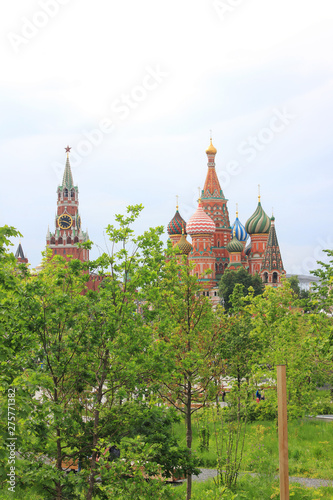 Zaryadye park on summer day with Kremlin tower with Saint Basil Cathedral on Red Square in Moscow, capital city of Russia 