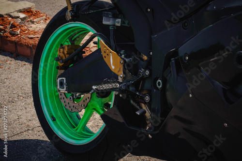 sports bike black with green wheels photo rear wheel