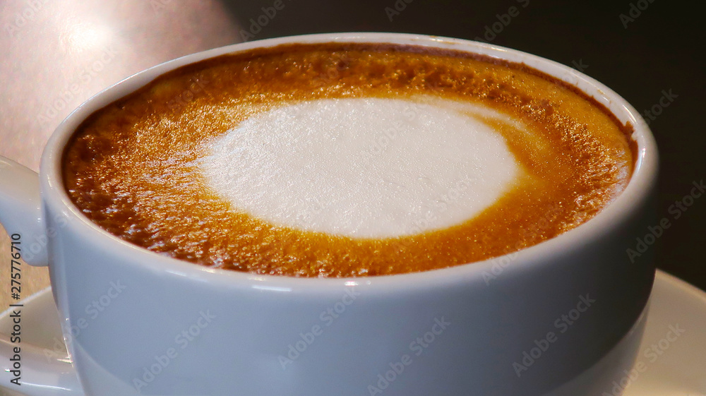 cup of coffee with cream on wooden background cup of coffee with cream on wooden background