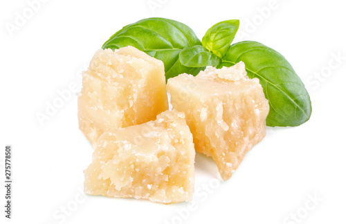 Three slices of permesan reggiano and basil bush isolated on white background, macro shooting, front view