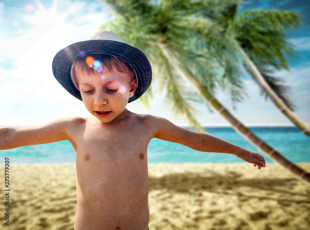Small boy on beach and summer time 