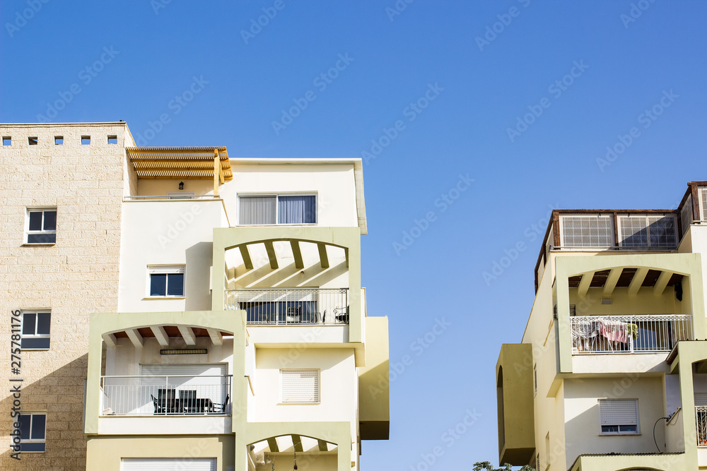 living buildings windows facade symmetry picture on blue sky background living buildings windows facade symmetry picture on blue sky background