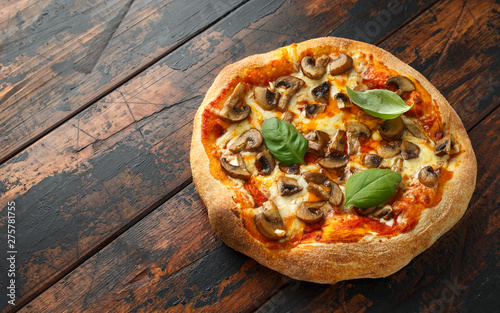 Hot Mushroom Pizza on wooden table. ready to eat. vegetarian food