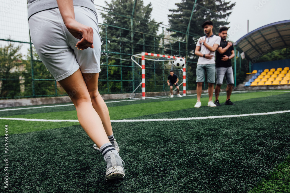 Fototapeta premium Soccer player with ball in action outdoors. Team play concept. Training time.