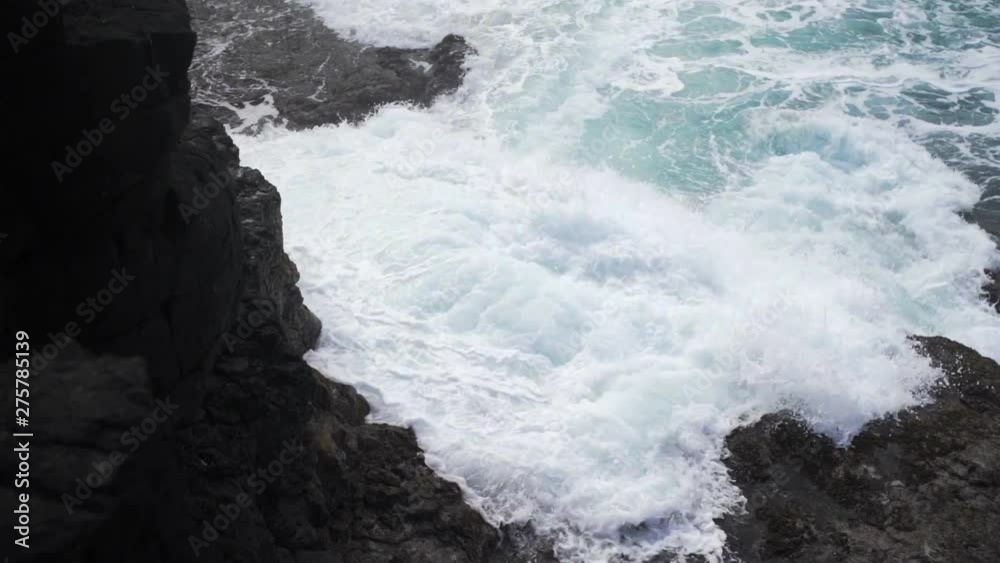 Slow Motion: Wave Crashes and White Water Rises Against Kauai Volcanic Rocks, Kauai, Hawaii Slow Motion: Wave Crashes and White Water Rises Against Kauai Volcanic Rocks, Kauai, Hawaii