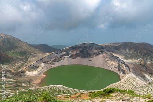 Beautiful view of Okama crater lake at Mount Zao in summer sunny day. active volcano in Miyagi Prefecture, Japan photo