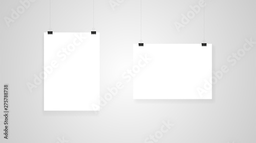 Empty advertising posters suspended from clips. Layout template on gray background.