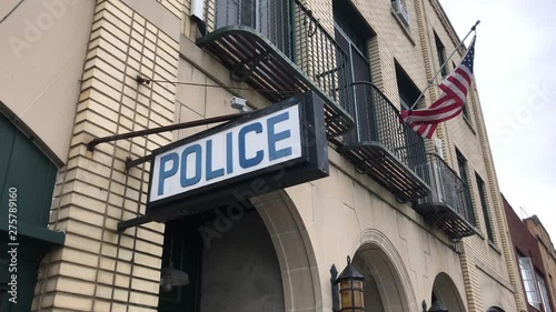 Police sign on exterior of station generic establishing
