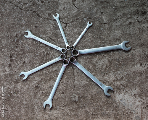 Wrenches, 7 pieces. Isolated on gray background. Different size. Copy space. There is a place for text.