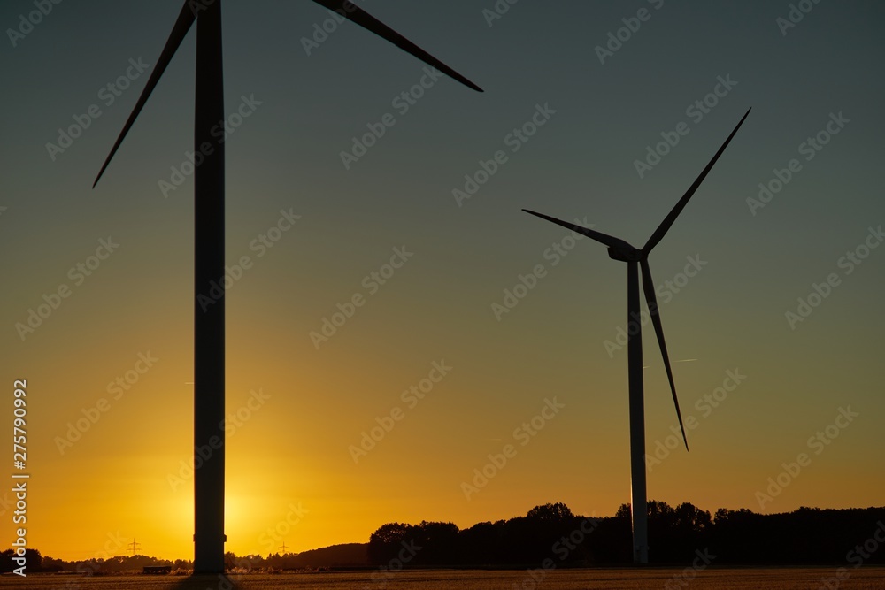 Silhouettes of Wind Turbines at Golden Sunset Silhouettes of Wind Turbines at Golden Sunset