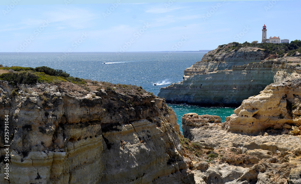 Cliffs and lighthouse on the Algarve coast
