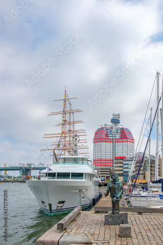 Statue and boats at the harbor in Gothenburg  Sweden