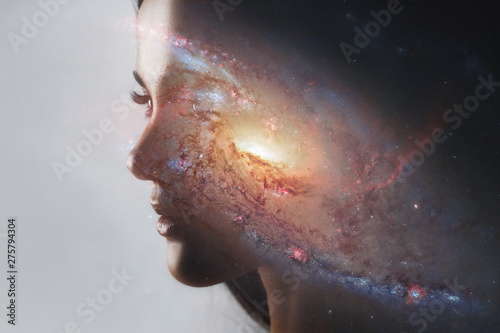 The universe inside us, the profile of a young woman and space, the effect of double exposure. scientific concept. The brain and creativity. Elements of this image furnished by NASA photo
