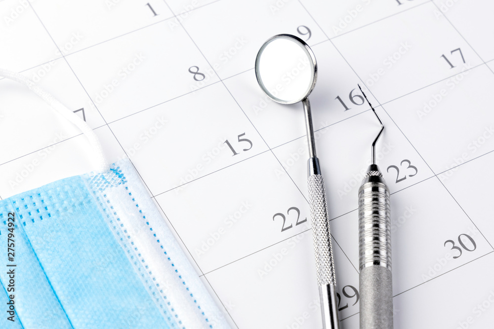Reminder dentist appointment in calendar and professional dental tools.