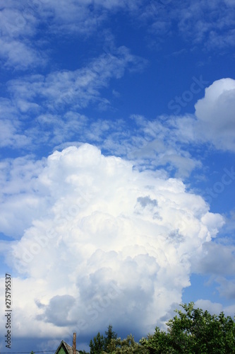 A large beautiful white cloud low above the ground. © Сергей Коваленко