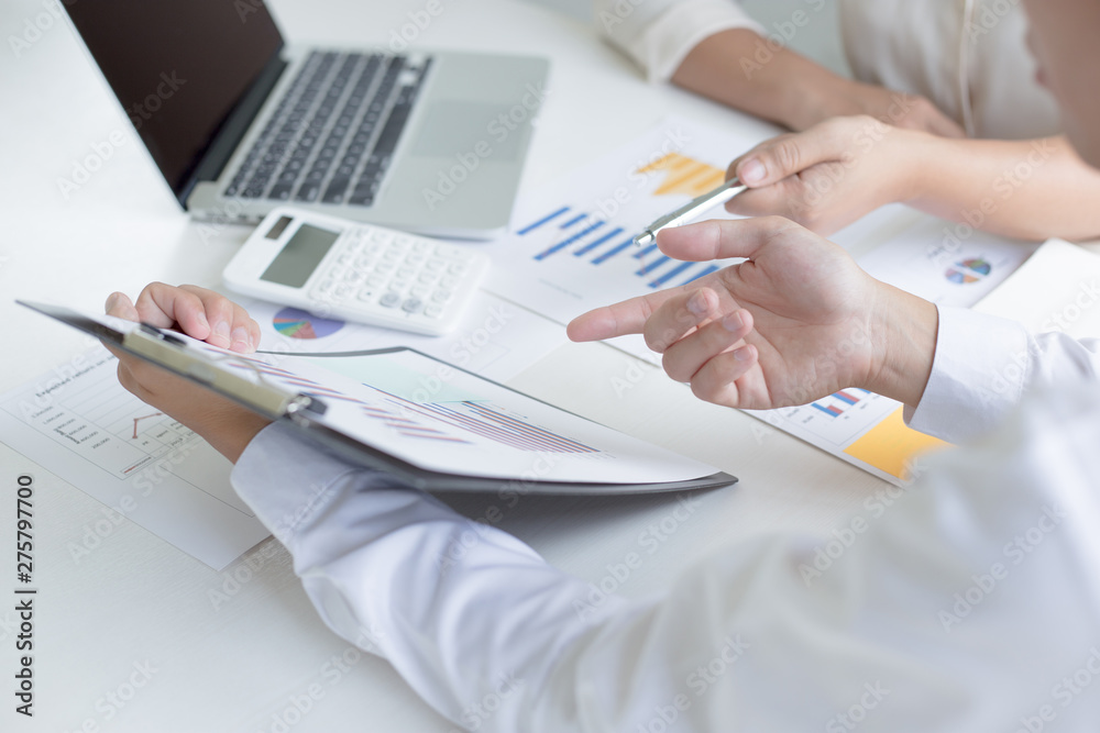 Fototapeta premium Both accountants have checked the company's finances. Have checked the work and profit of the company In order to plan for business expansion to the European zone and nearby areas