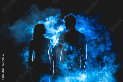 The silhouette of couple in the smoke
