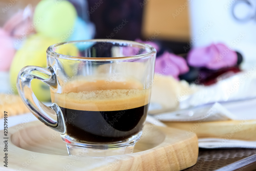 Cup of espresso coffee on wooden plate in morning time. Cup of espresso coffee on wooden plate in morning time.