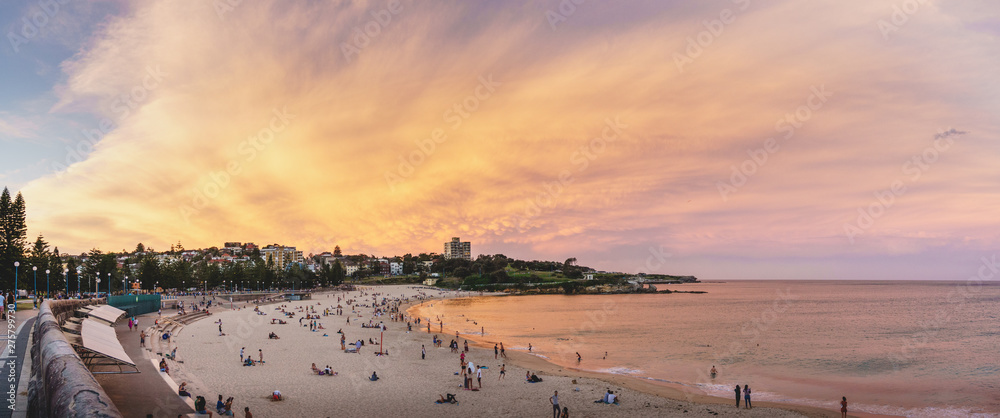 Fototapeta premium Coogee Beach, New South Wales - APRIL 14th, 2017: Colourful summer sunset over Coogee Beach.