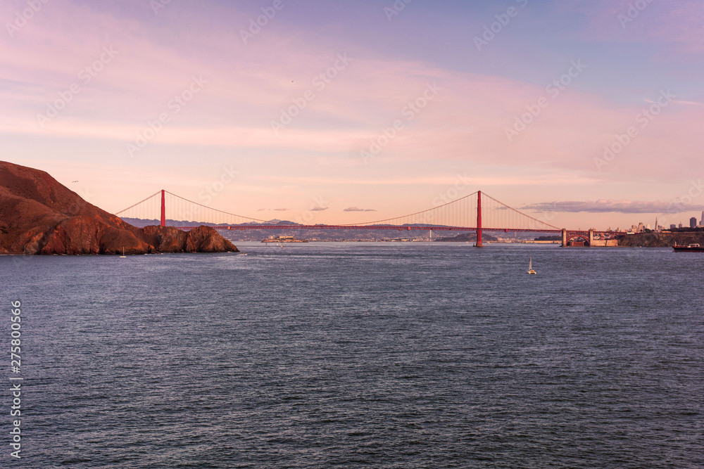 Golden gate bridge panorama at sunset shoot from Point Bonita lighthouse. California, USA.