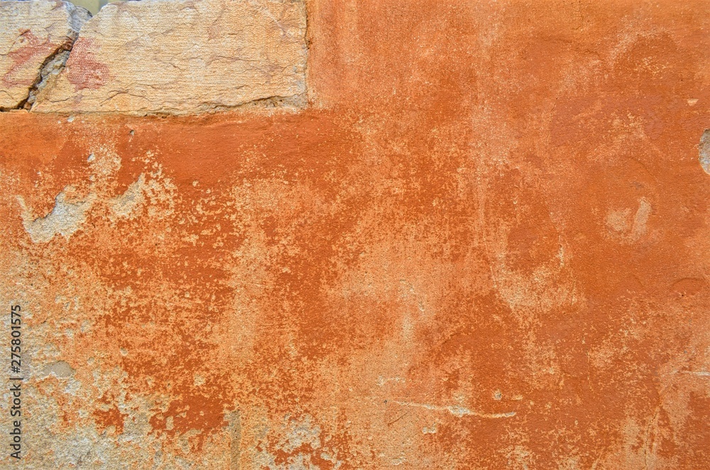 terracotta faded surface of the old wall