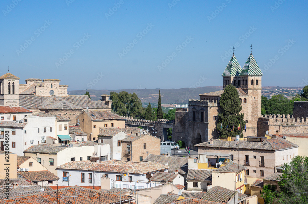 Toledo, Spain - April 30 / 2019 : landscape of toledo old town composed of houses and port bisagra
