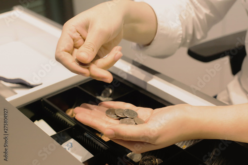 Employees are counting on the shop for customers to buy Woman's hand