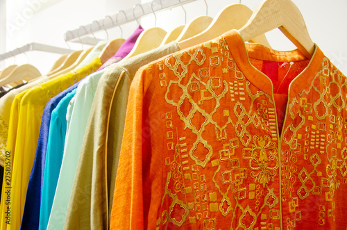 Indian women kurtis or lehanga on a rack for sale at a clothing store photo