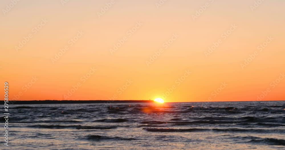 Beautiful fiery sunset sky on the beach. Composition of nature, Waves of the sea on a sandy beach. Beautiful fiery sunset sky on the beach. Composition of nature, Waves of the sea on a sandy beach.