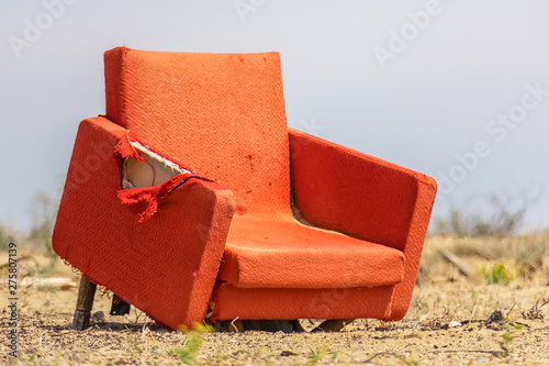 Old age is not a joy, a lonely broken home chair in the sultry steppe, Baikonur, Kazakhstan